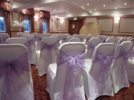 chair covers violet sashes